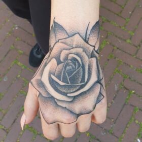 hand rose tattoo