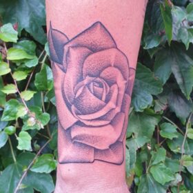 hand rose tattoo